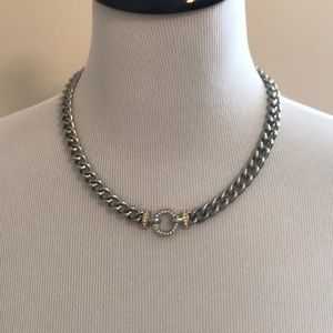 Silver link chain. Adjusts up to 19 inches